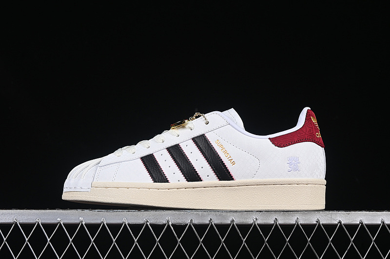Adidas ORIGINALS SUPERSTAR YEAR OF THE SNAKE CLOUD WHITE/CORE BLACK/ACTIVE MAROON · JR8036, photo 1