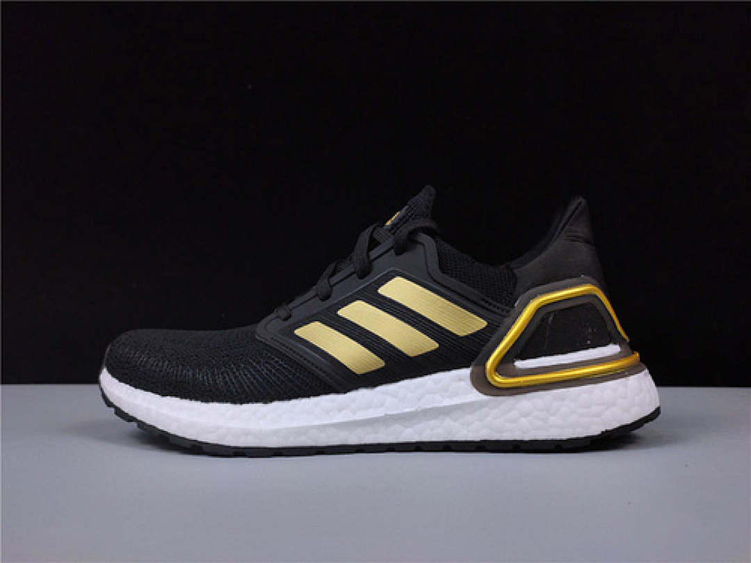 On Running On Running ULTRA BOOST 20 CONSORTIUM SHOES CORE BLACK/GOLD/CLOUD WHITE · EE4393, photo 1