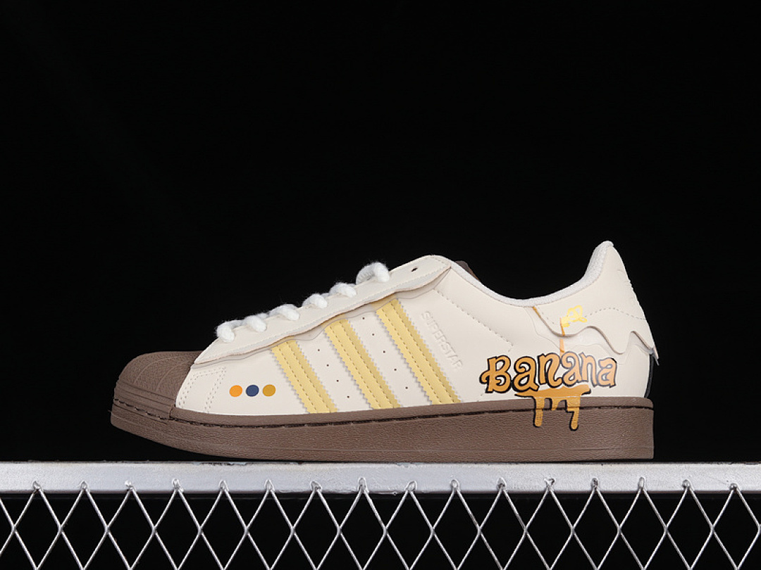 Adidas SUPERSTAR SHOES CLOUD WHITE/YELLOW/DARK BROWN · GW4440, photo 1