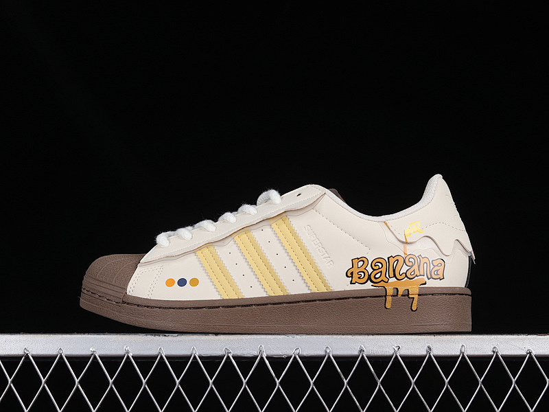 Adidas SUPERSTAR SHOES CLOUD WHITE/YELLOW/DARK BROWN · GW4440, photo 1